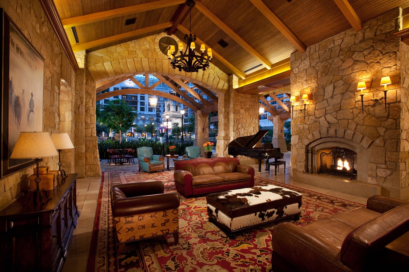 Gaylord texan lobby sitting area with grand piano and fireplace