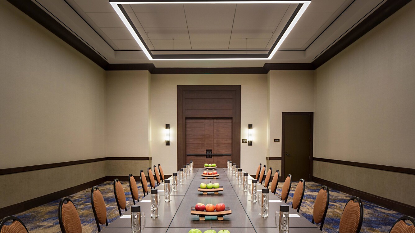 San saba meeting conference room with table, chairs, and water setup