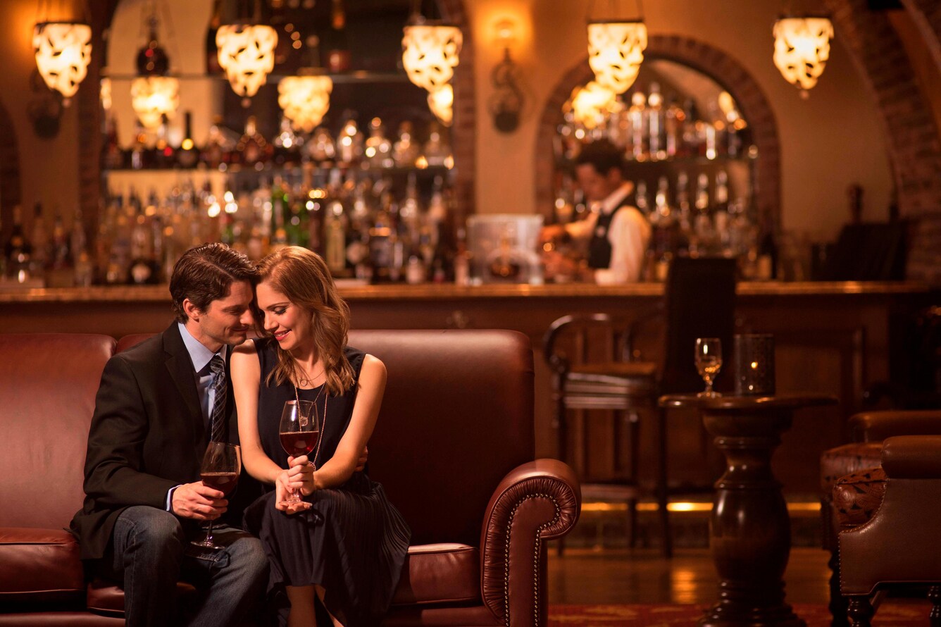 Couple sitting together at restaurant bar