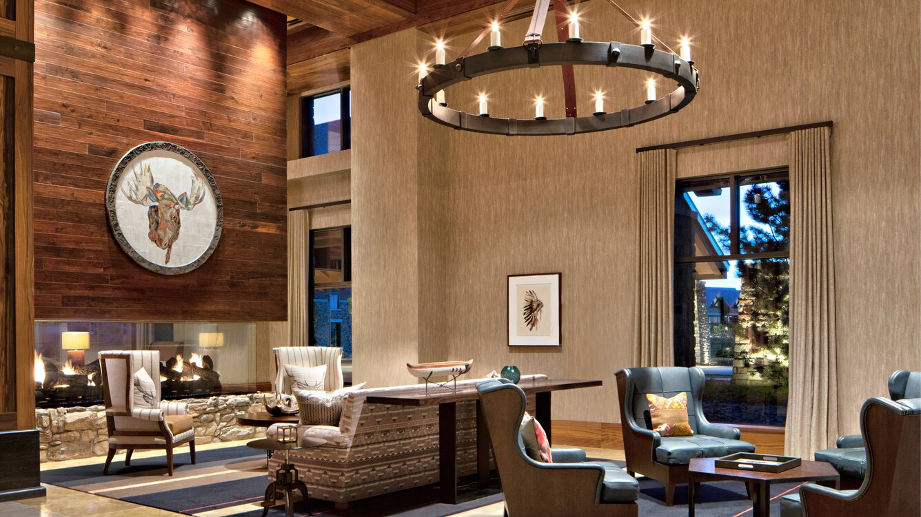 Padded chairs, sofa and fireplace in the Cocoa Bean.