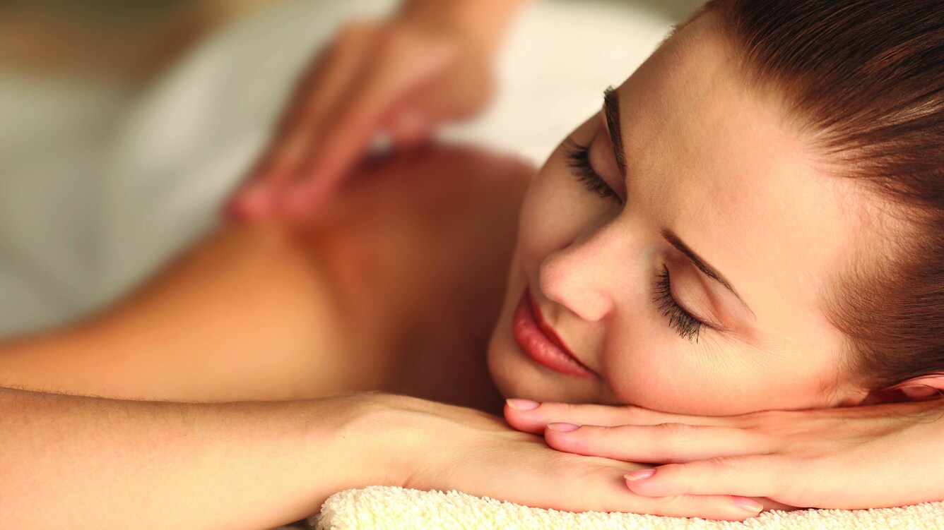 Woman receiving a back massage.