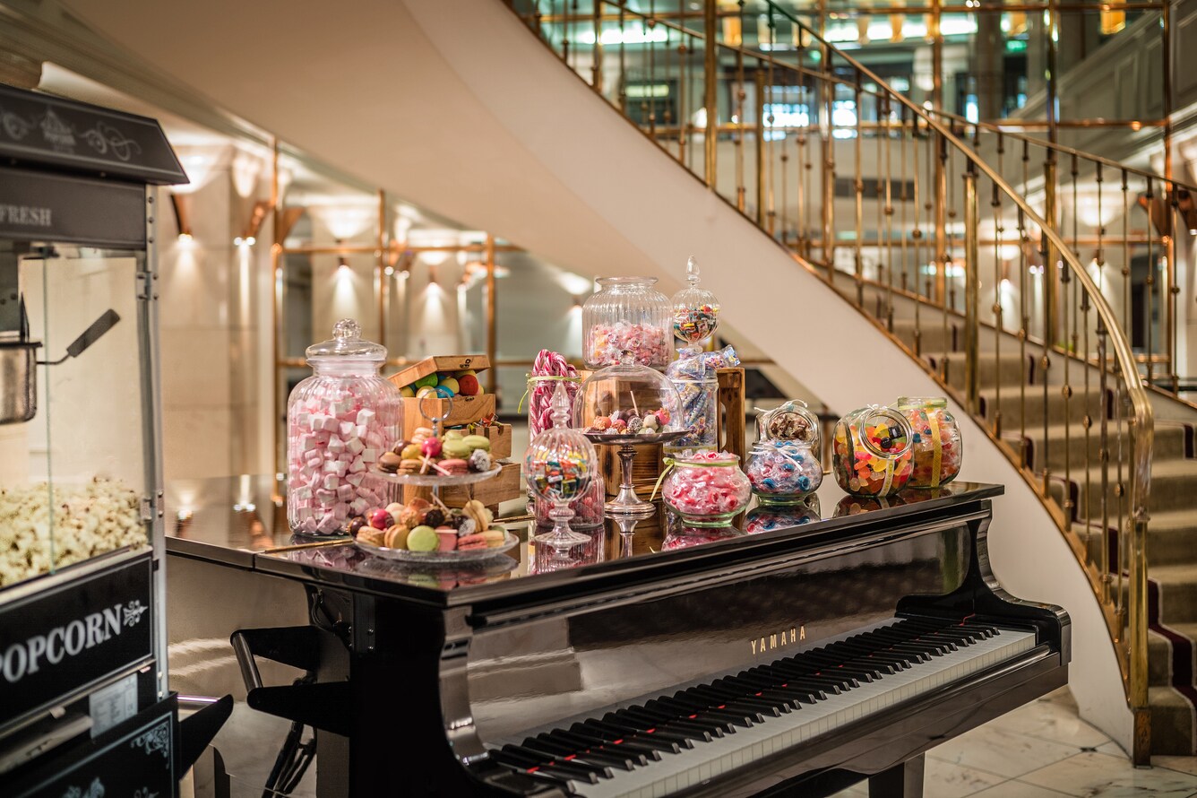 Piano with an assortment of candy stacked on top