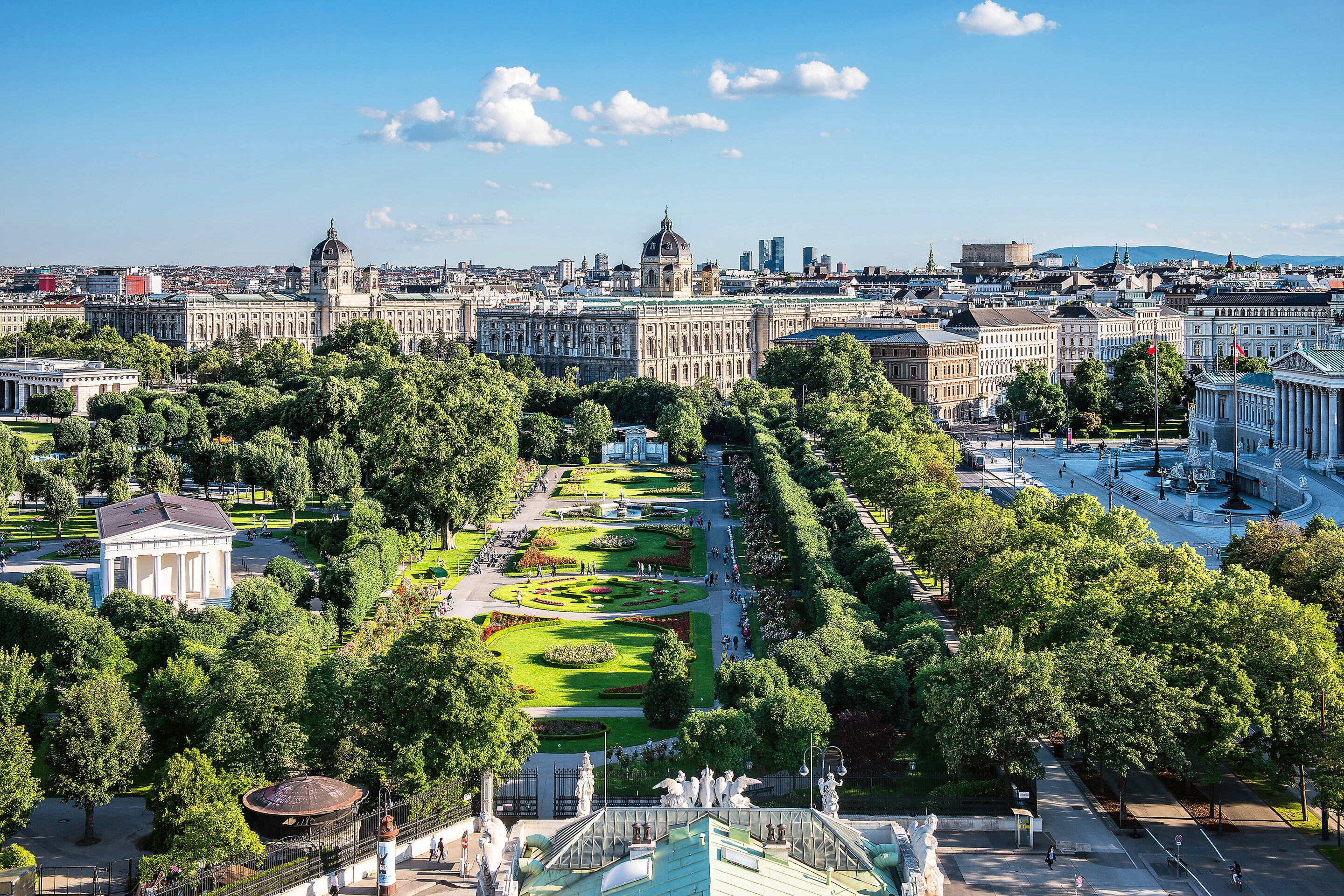 Large green park surrounded by museums and classic buildings