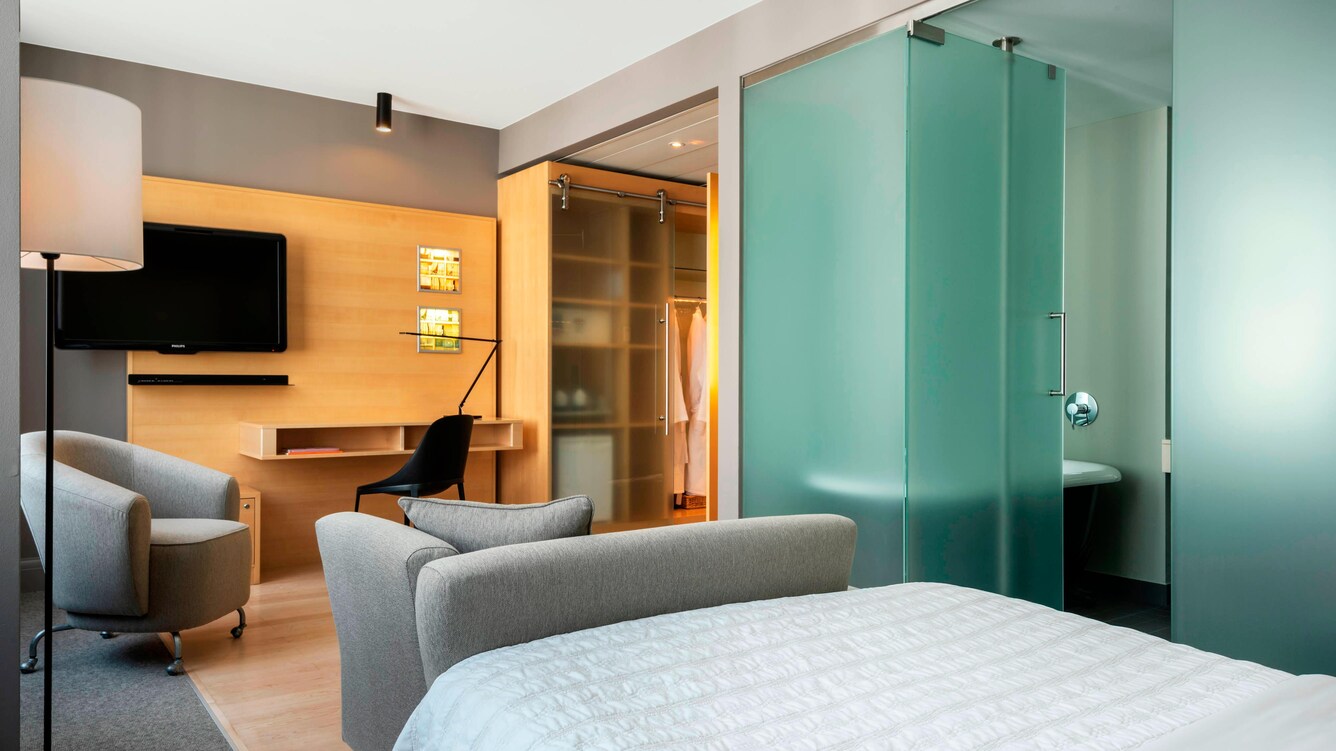 guest room with nearby shower, and sitting area