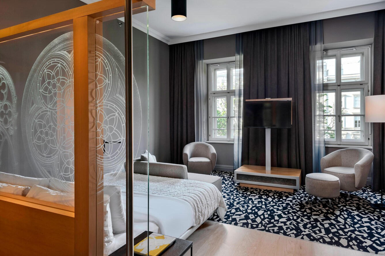 guestroom with sitting area and etched glass