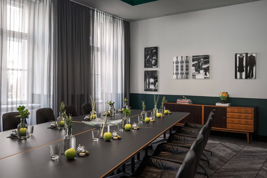 long black table with apples on it