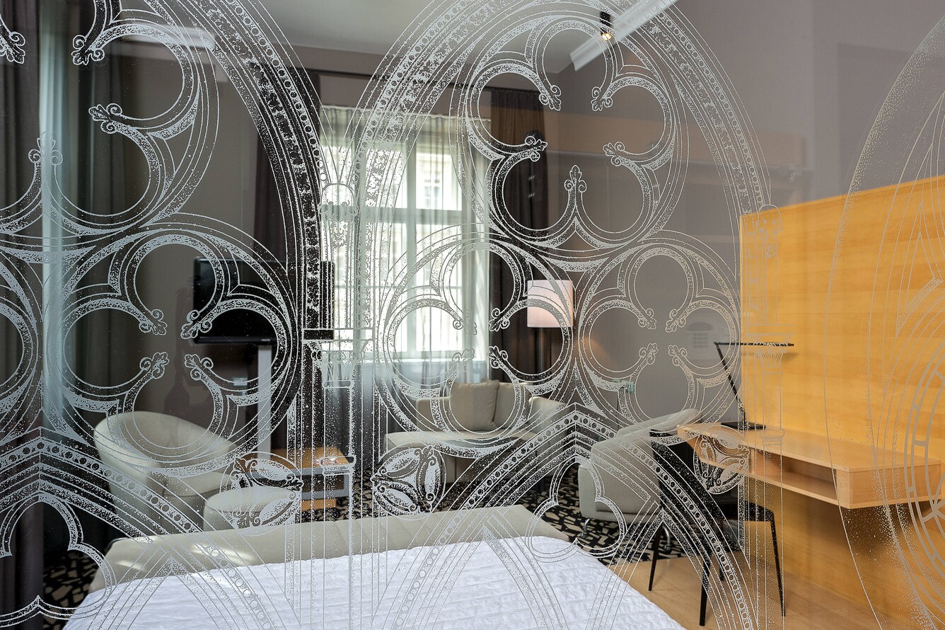 room through etched glass with sitting room and desk