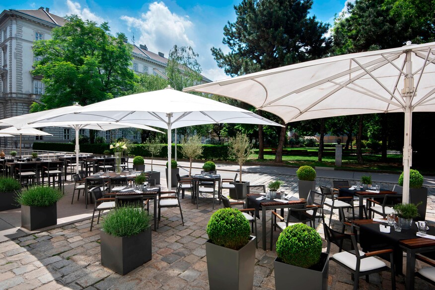 patio area with large white umbrellas