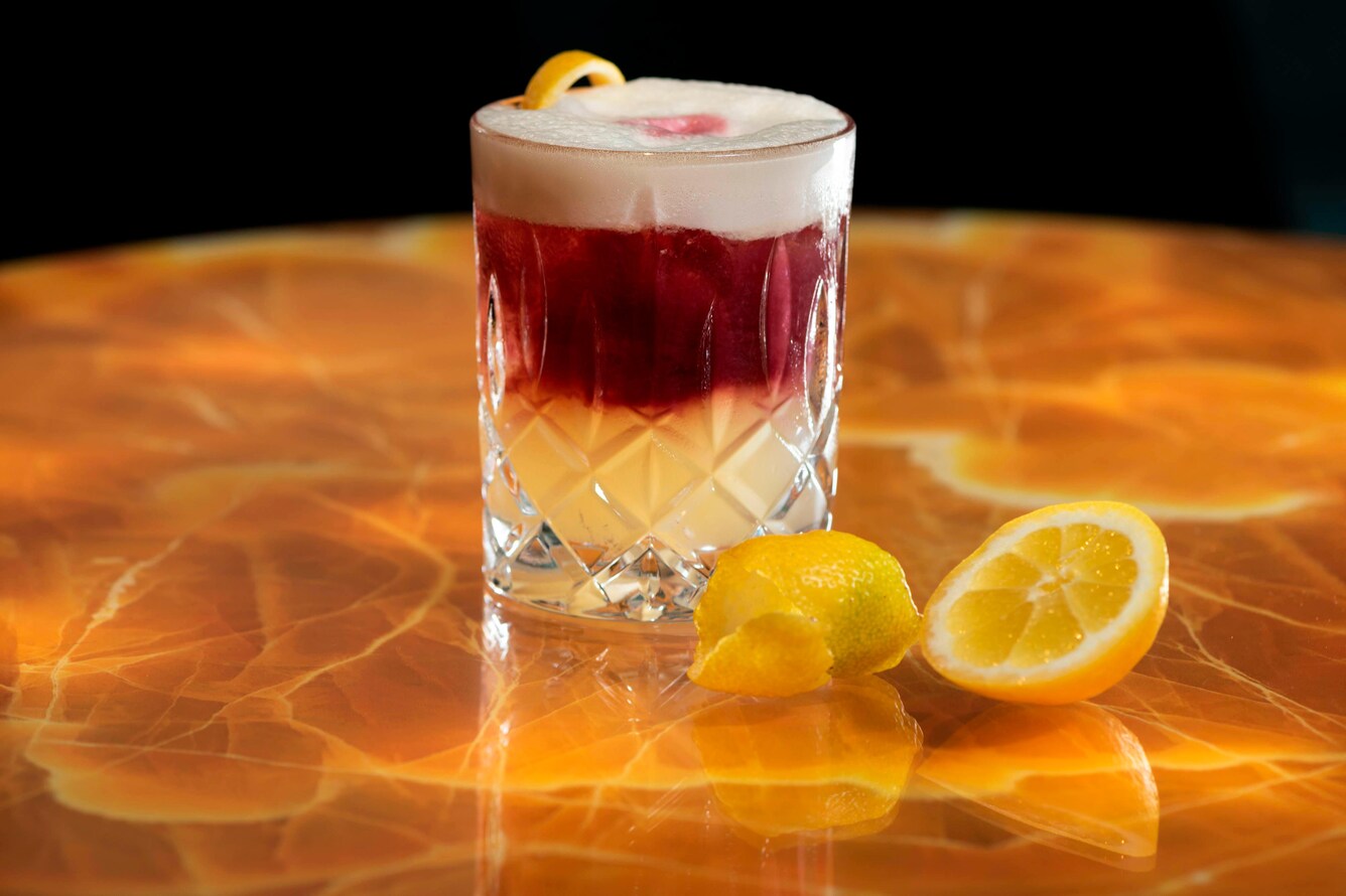 cocktail with orange on gold table