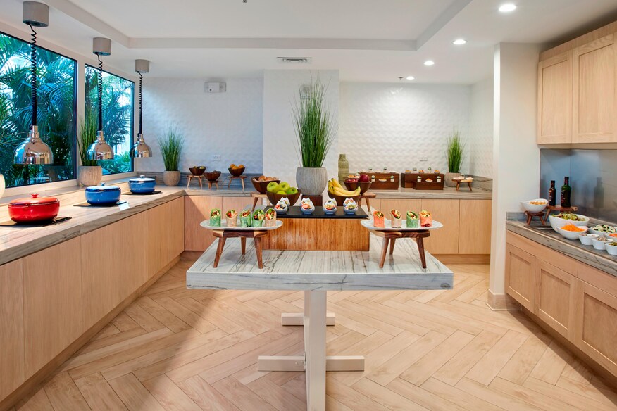 Table with food on it in the Tradewinds Club Lounge area.