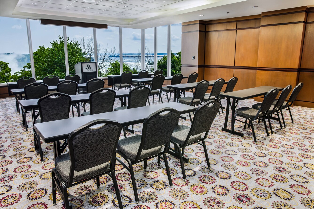 Rows of three seat tables with falls in the background