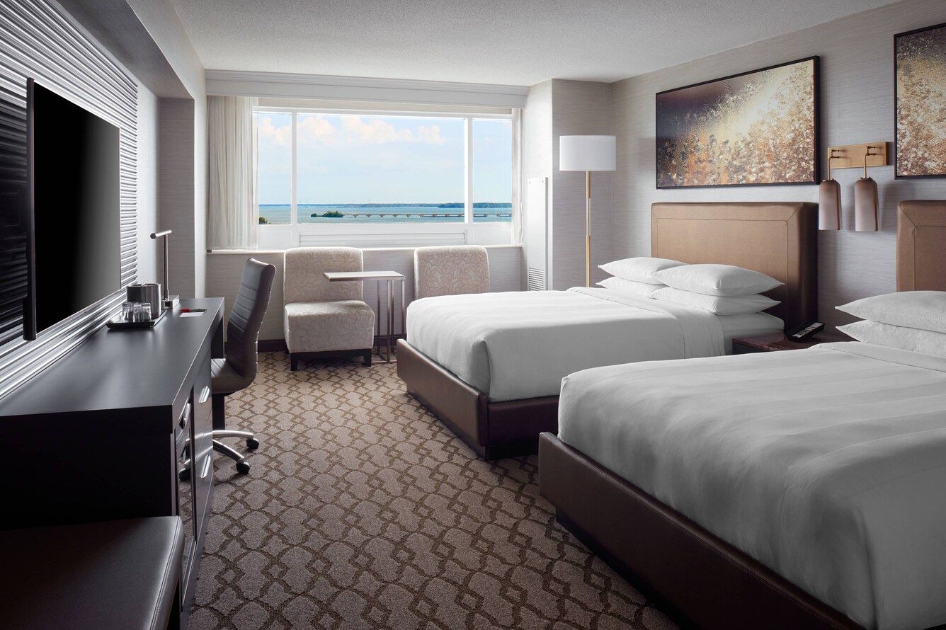 two queen beds with window overlooking falls