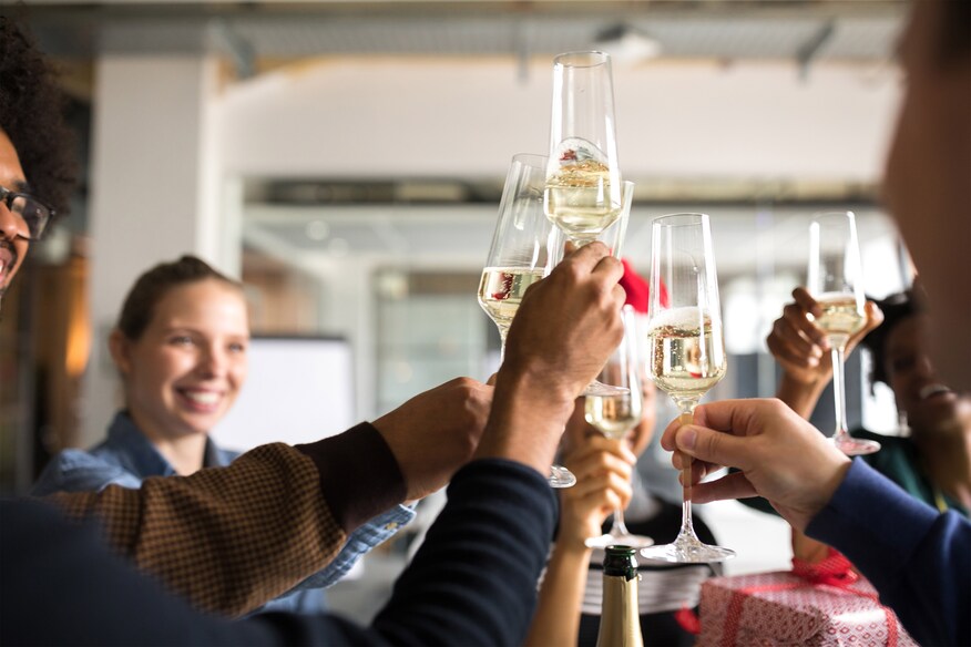 Raised champagne glasses.