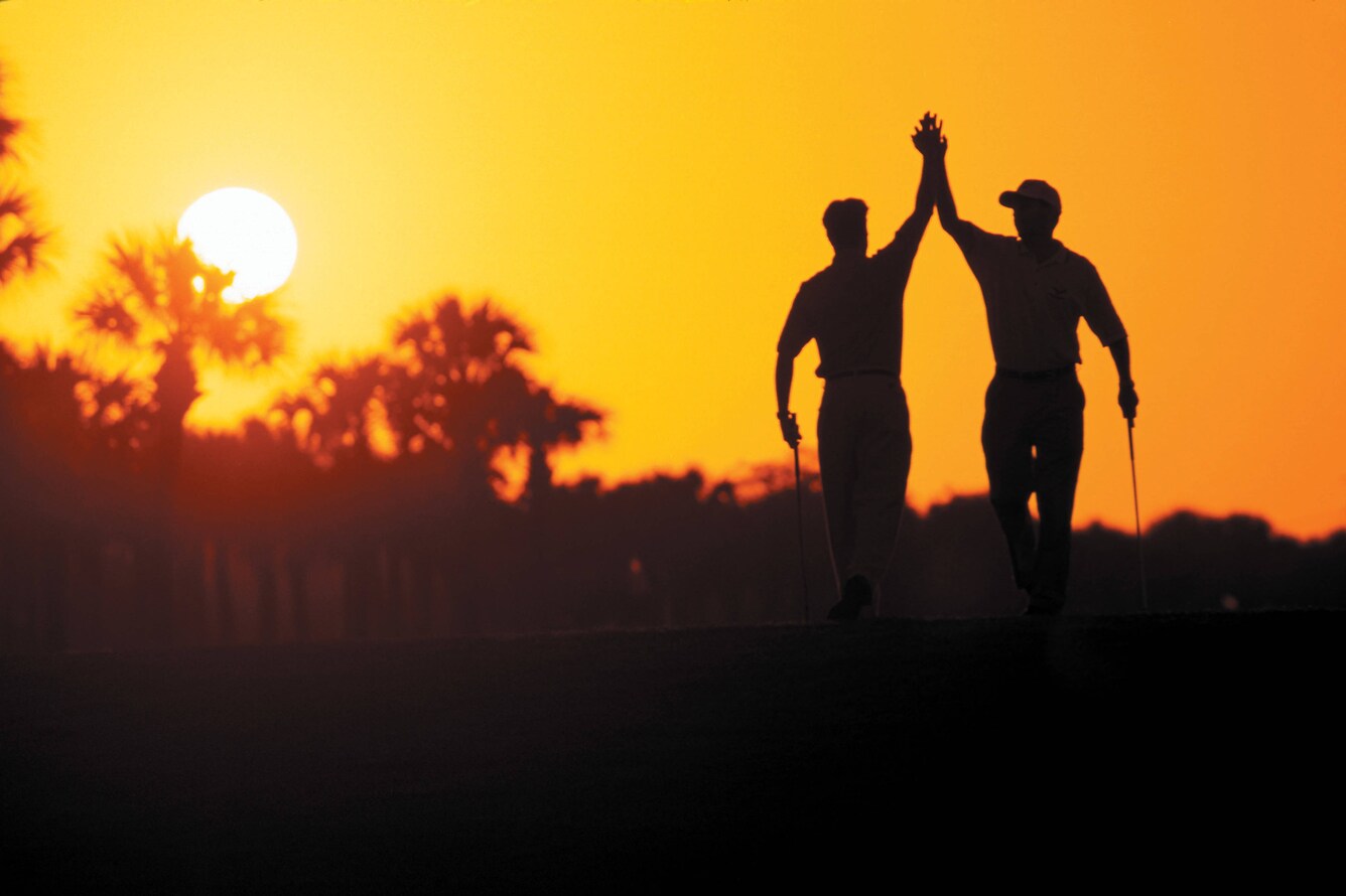 golfers high fiving