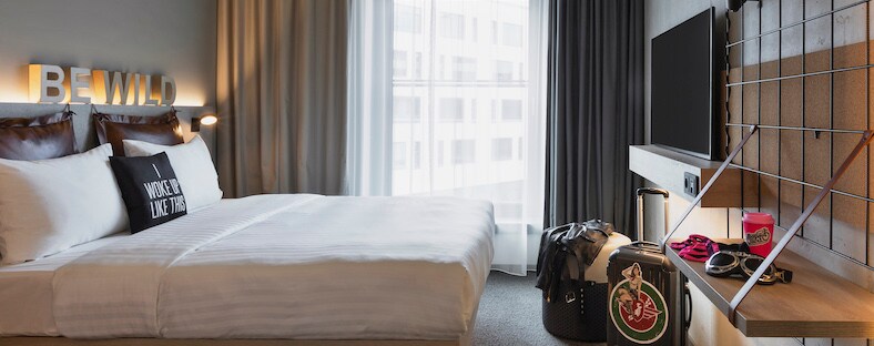Miami moxy queen guest room with luggage