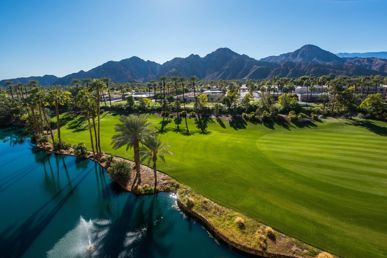Course fairway with mountain skyline in the background.