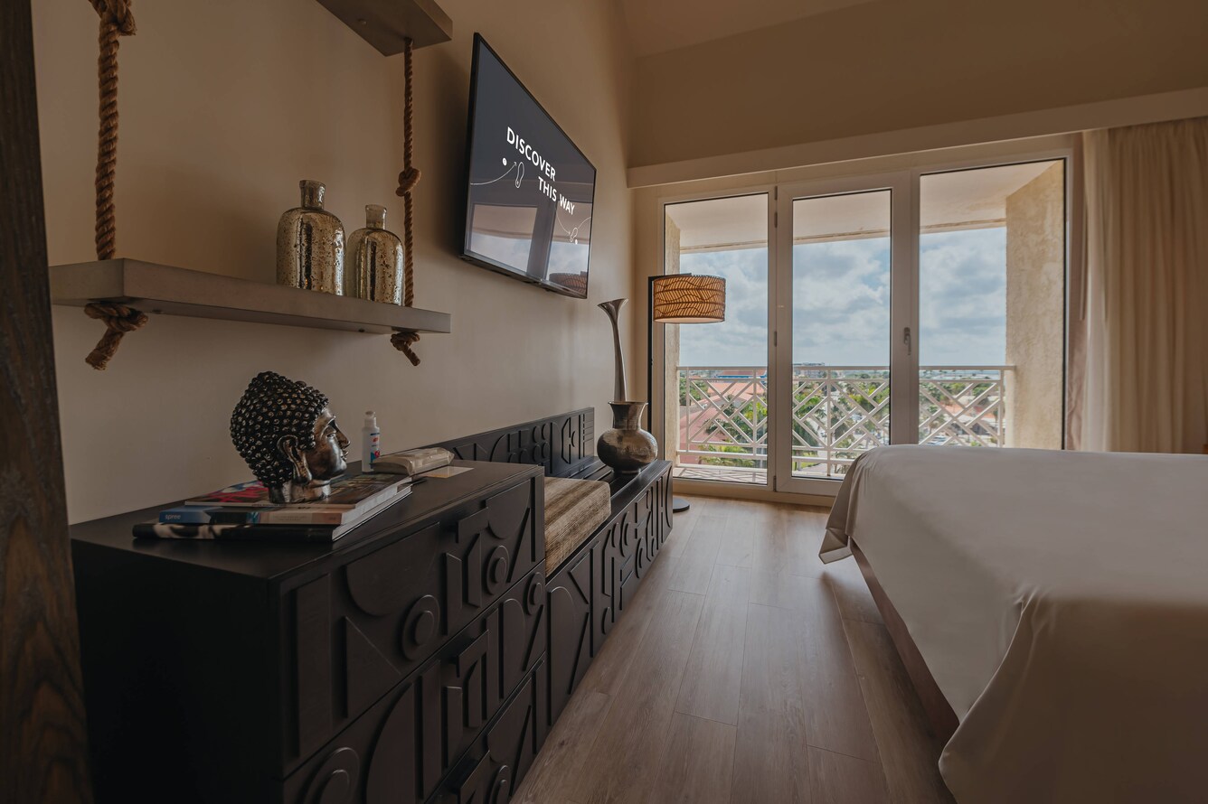 bedroom with bed and wall hung TV