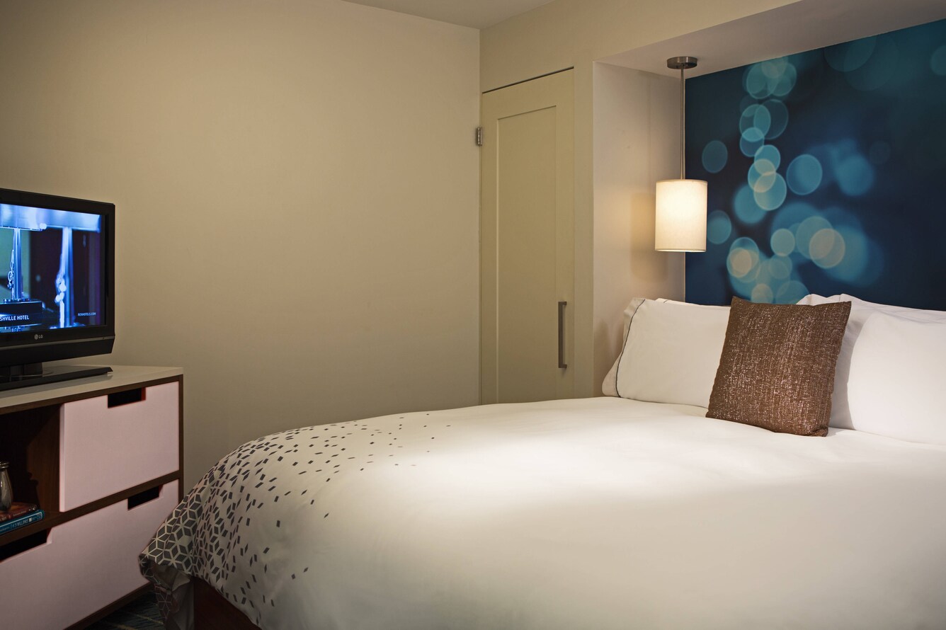 Suite with king bed and TV