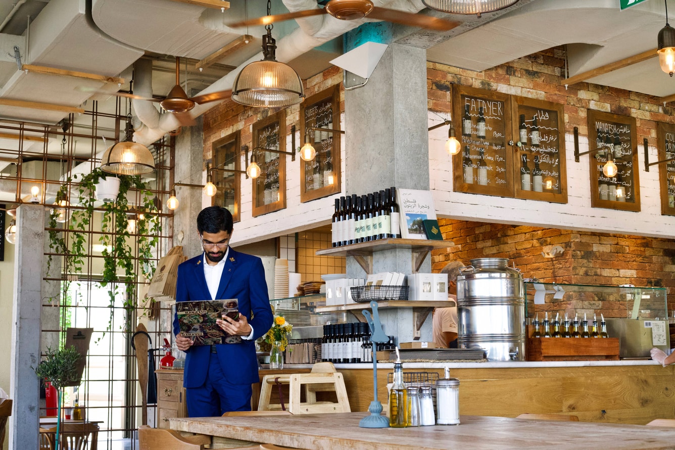 Hotel concierge navigator reviewing menu