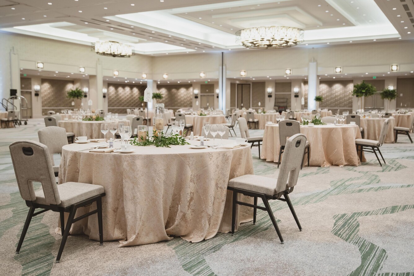 Ballroom set up for a wedding reception.