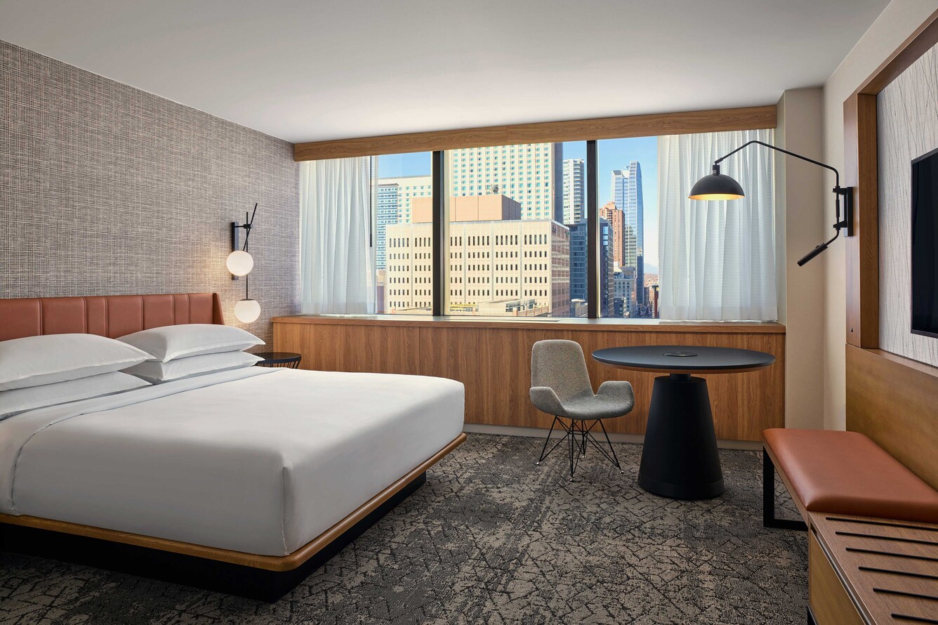 guestroom with window overlooking city.
