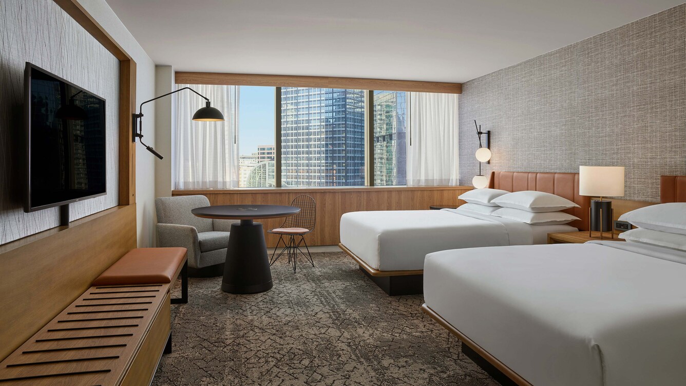 Guestroom with view overlooking city.