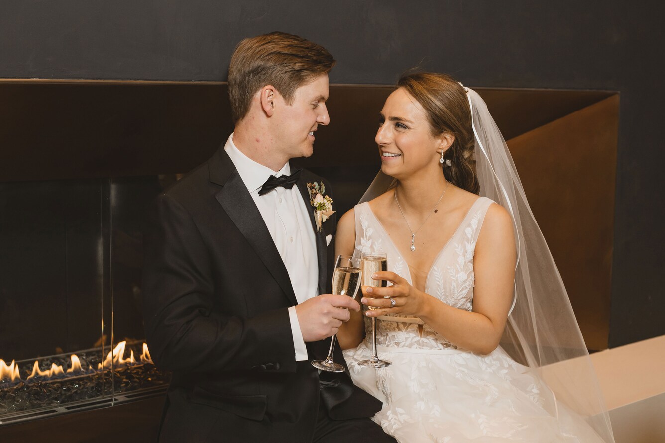 A Bride and Groom engaged in a toast.