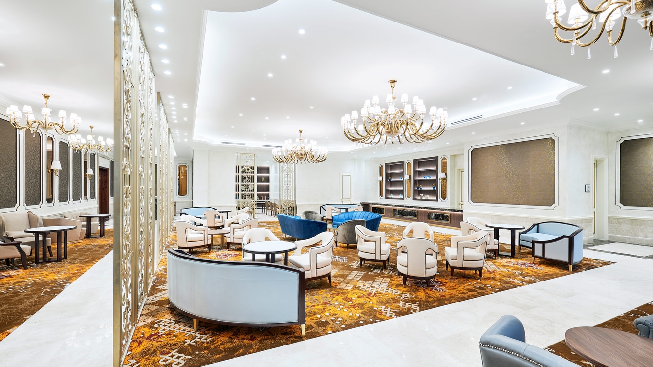 Danang room interior with an assortment of tables and chairs in a causal arrangement.