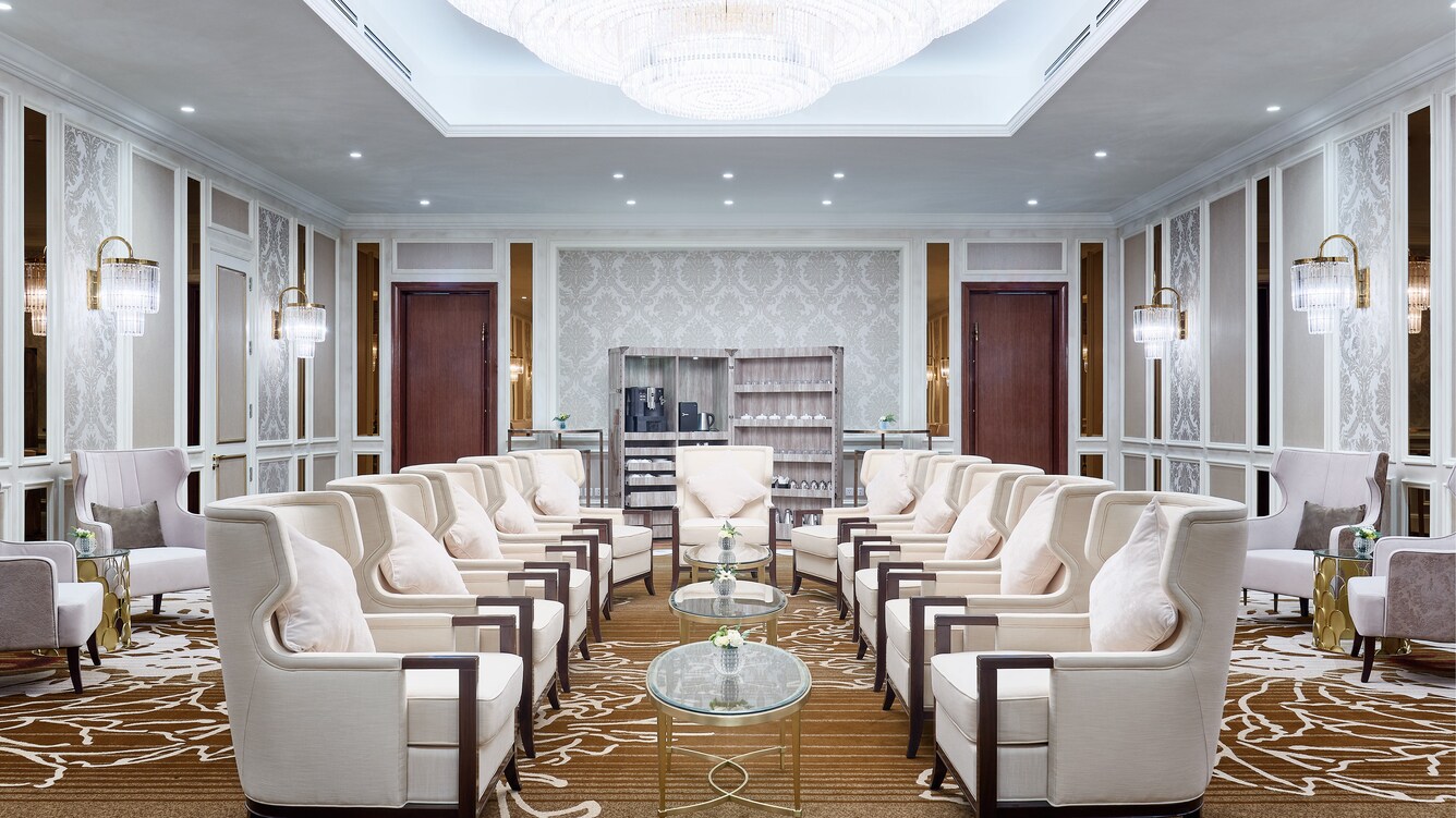 Saigon room with two rows of chairs facing one another.