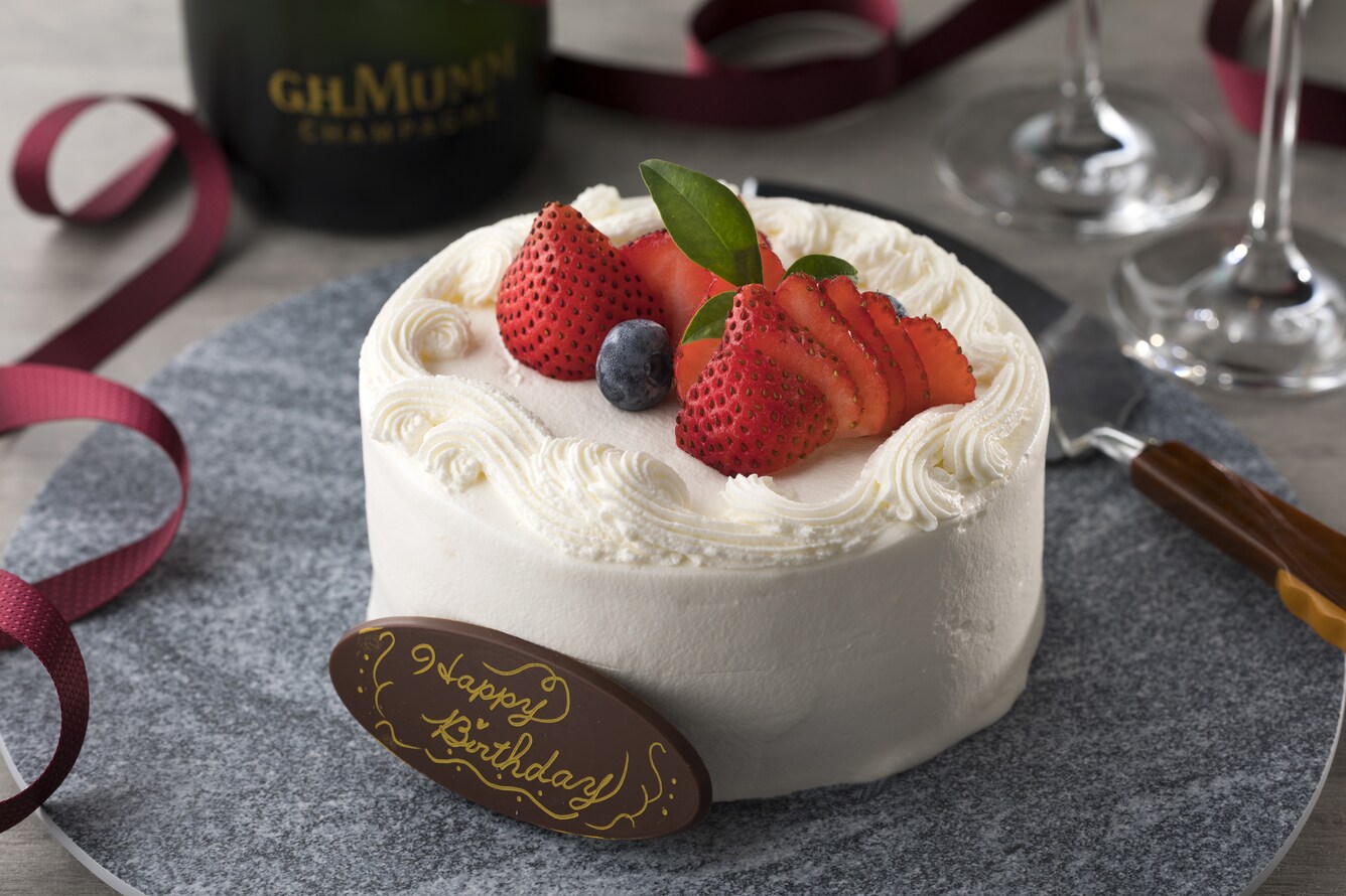 Decadant small white cake with strawberries