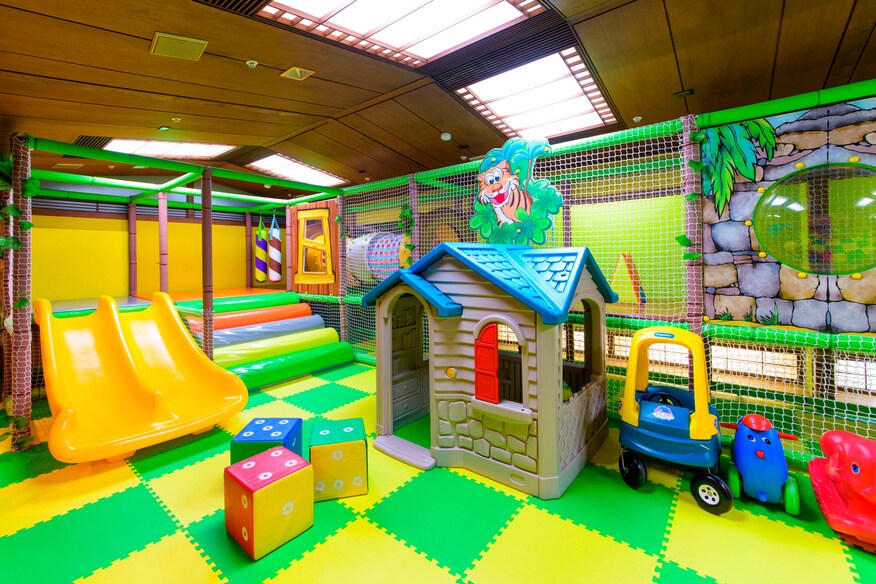 The cove kids play area with slides and toys