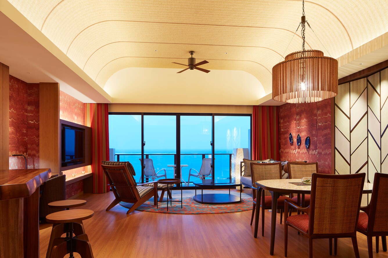 Sunset suite living area with kitchen table and balcony view
