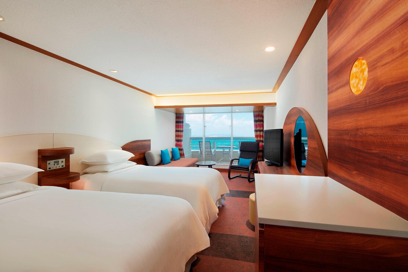 High floor deluxe room with two twin beds and balcony