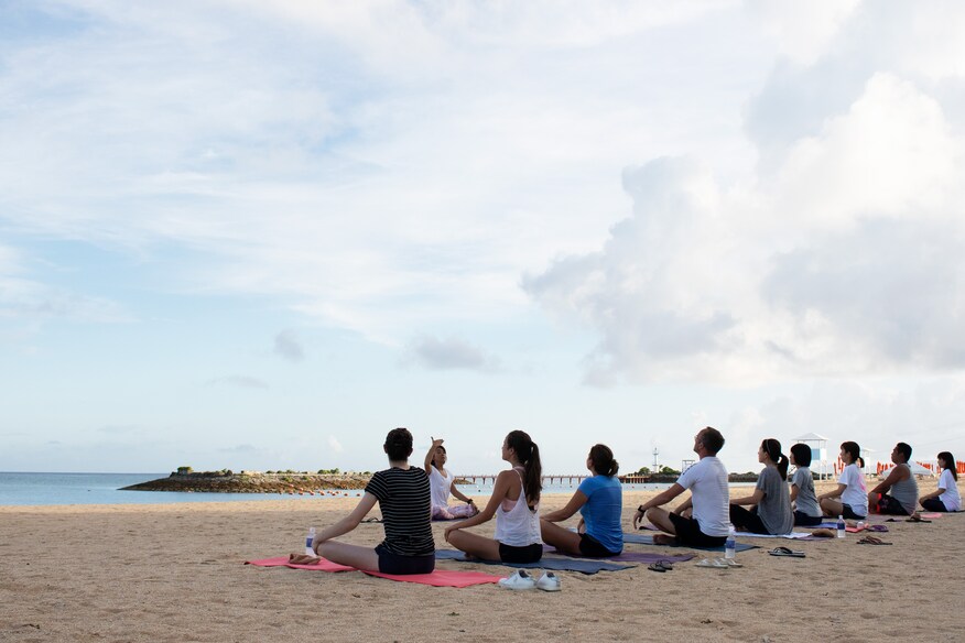 Yoga students on the beach