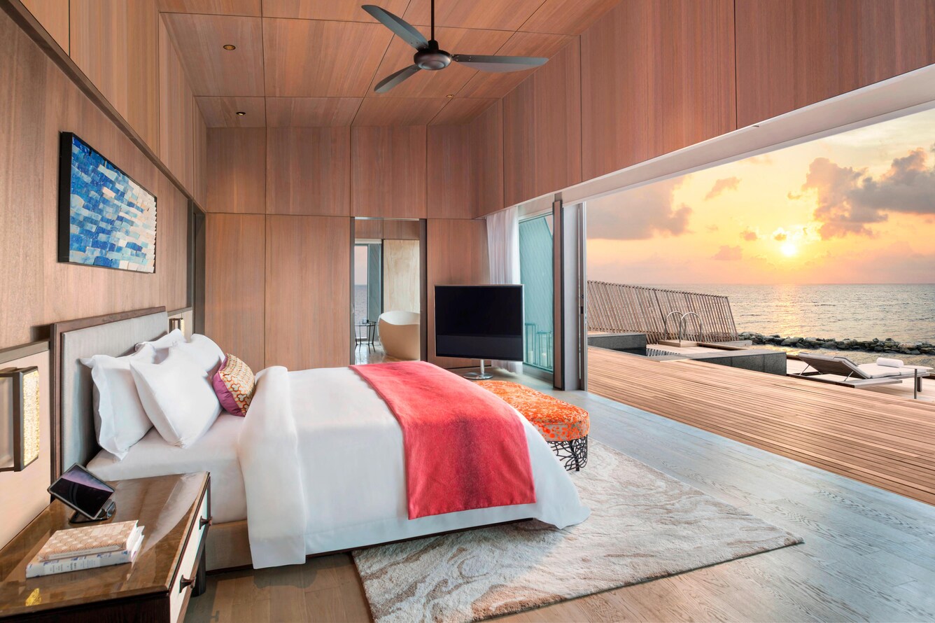 Indoor, outdoor design with Double bed and retractable windows that open onto the deck