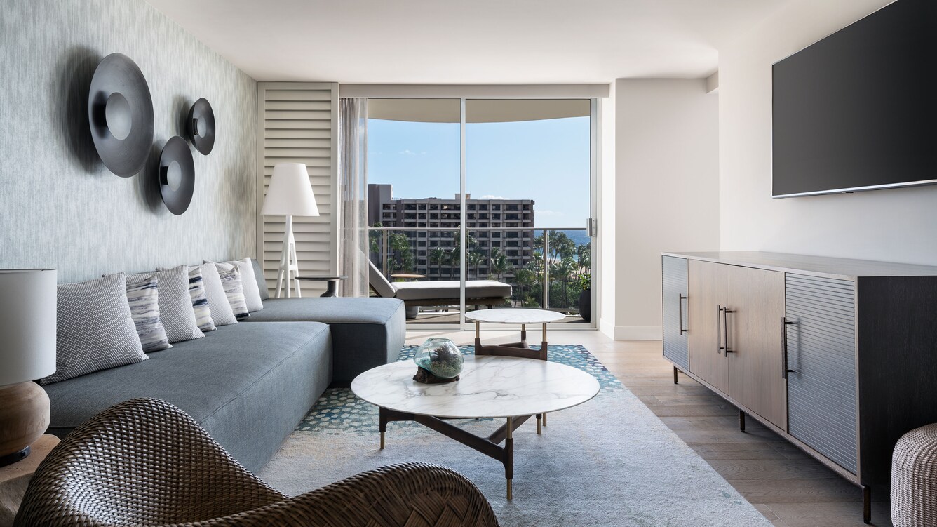 Luxury Suite living area, sofa and view of the balcony.