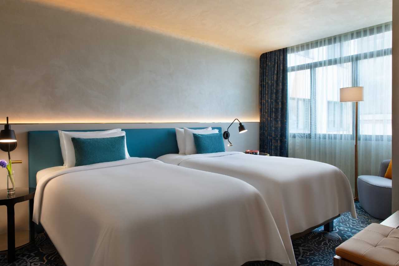 Suite bedroom with two beds.