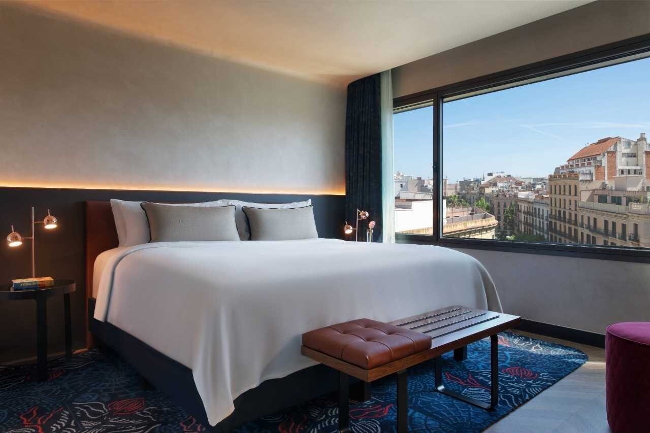 Suite bedroom with one bed and a view.