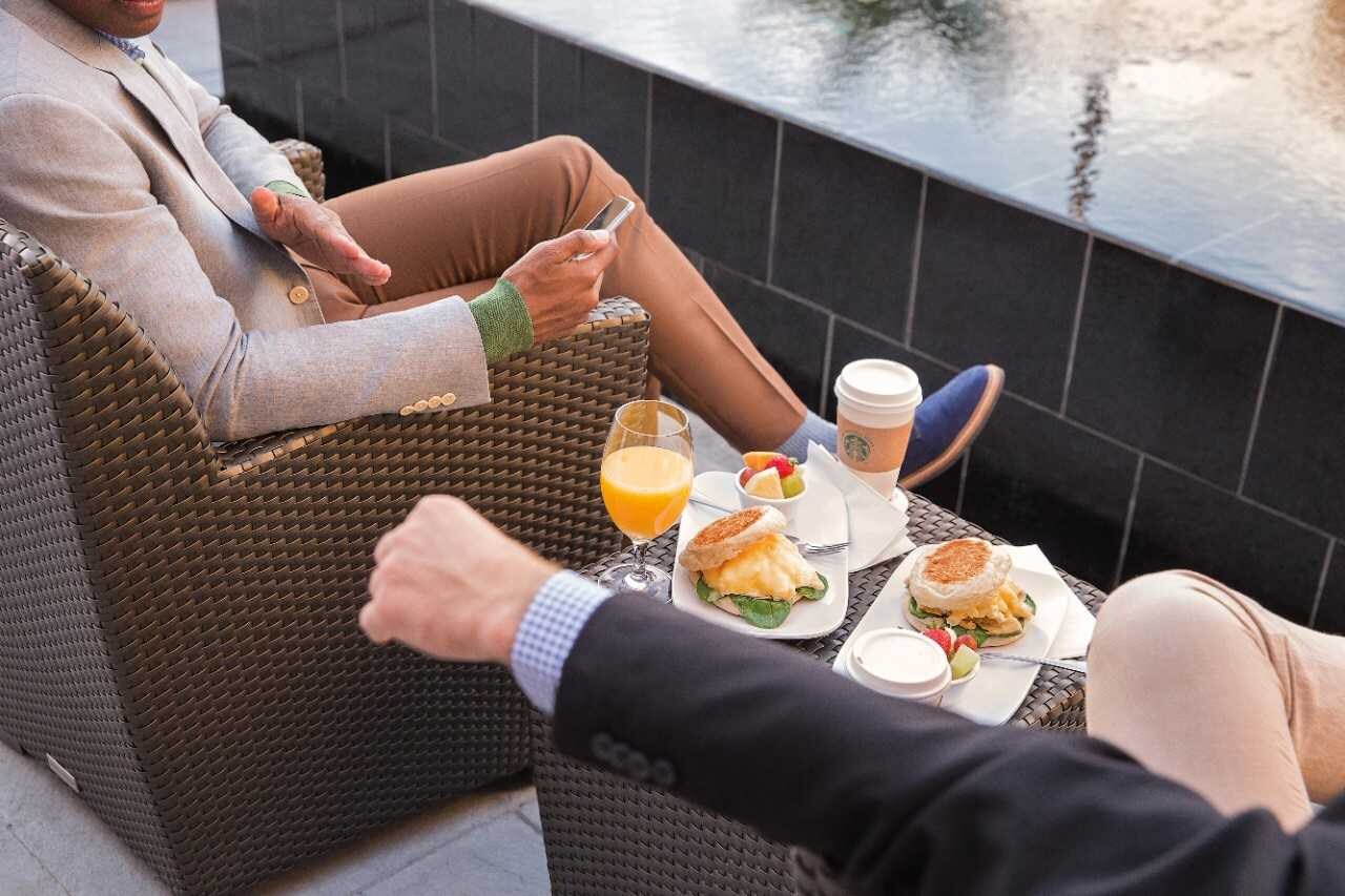 People enjoying food and beverages outdoors