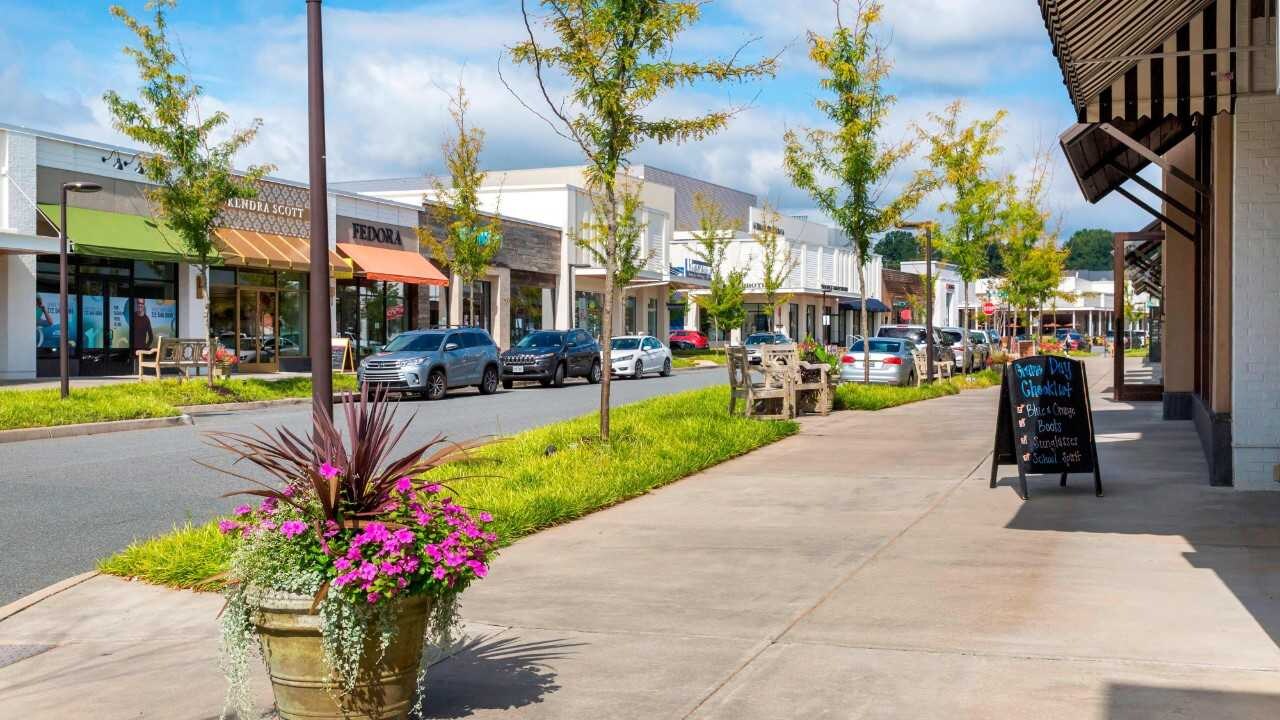 Sidewalk view of The Shops at Stonefield in daytime.