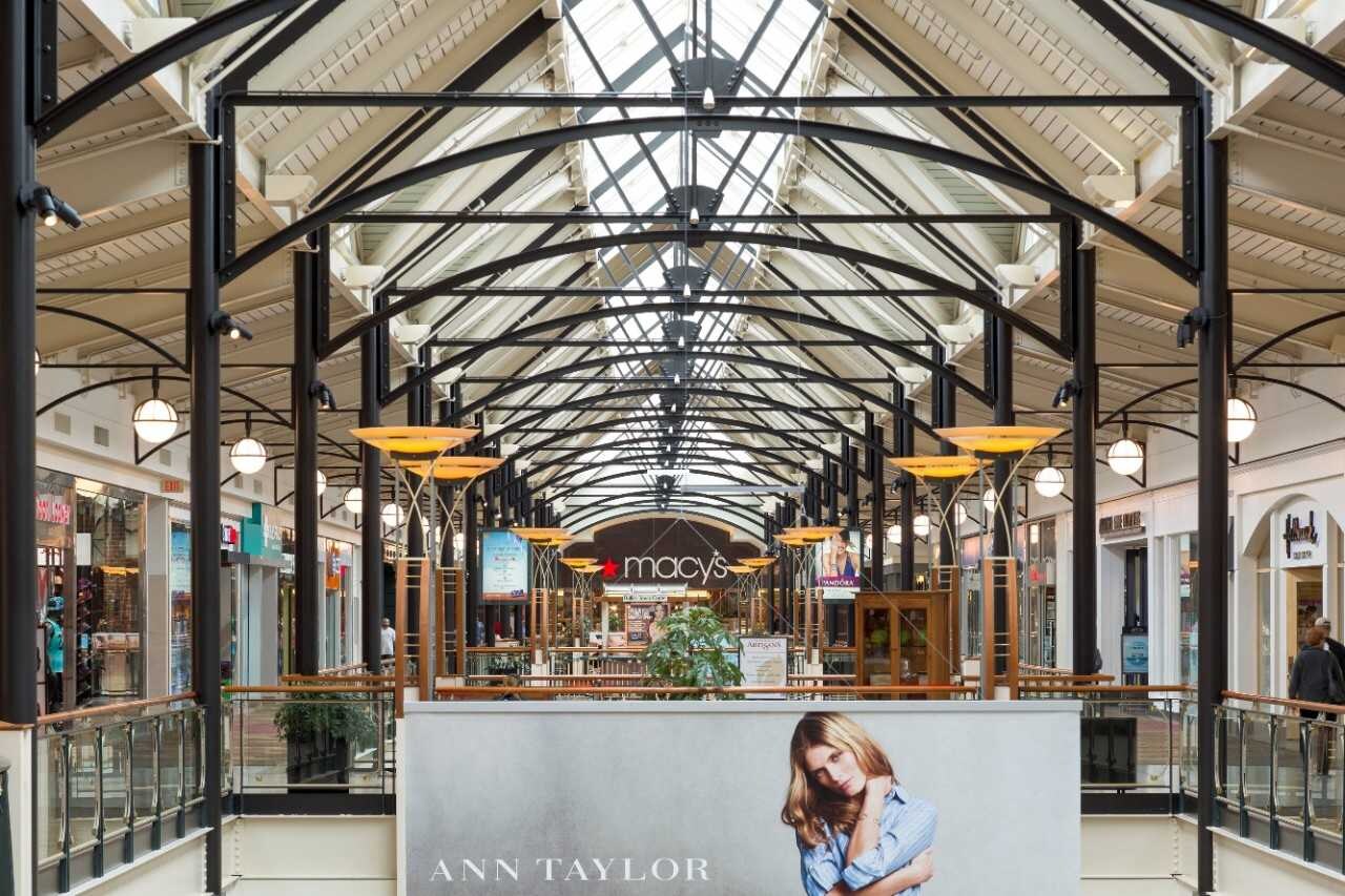 Shopping mall hallway with skylights.