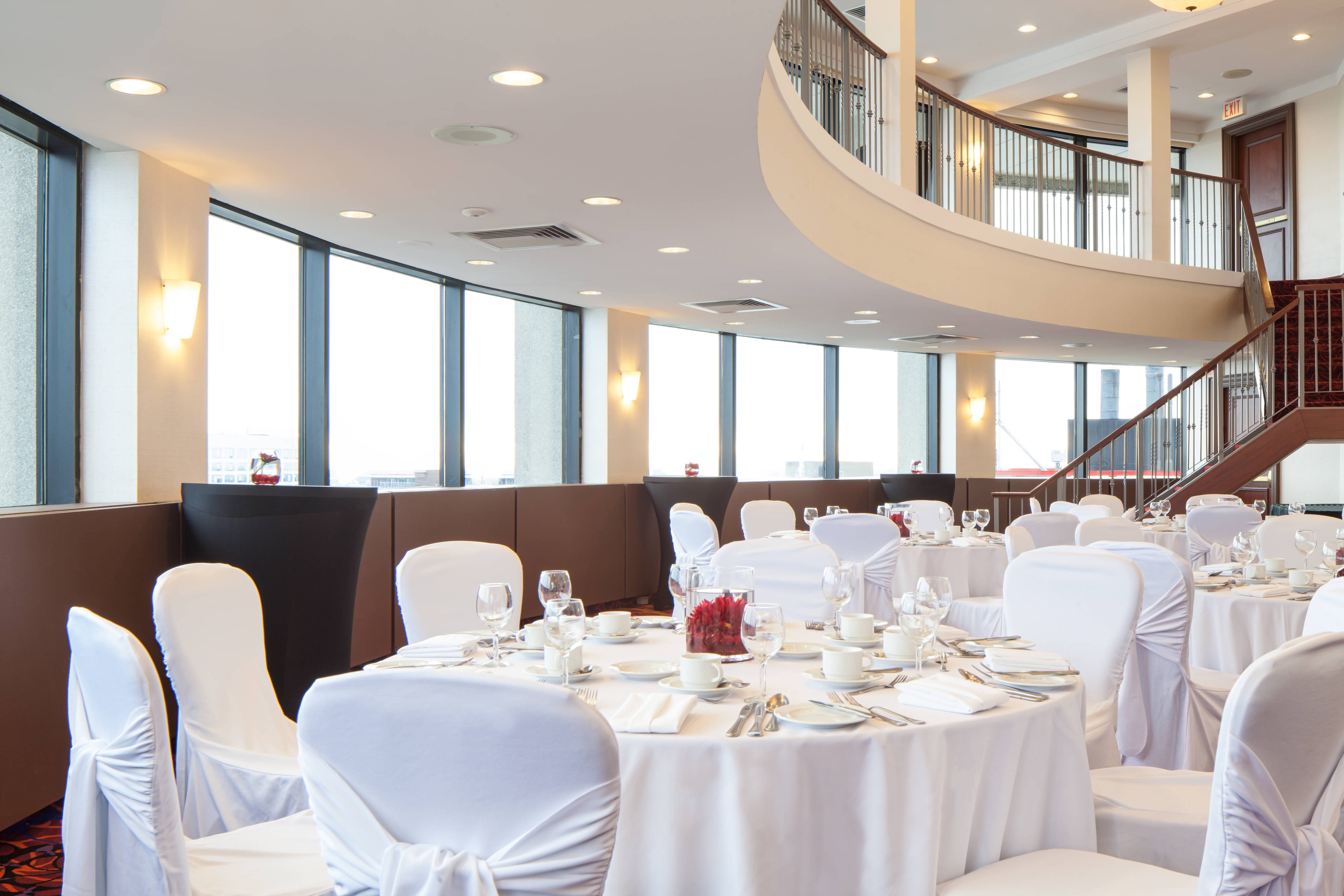 White tables with red flowers