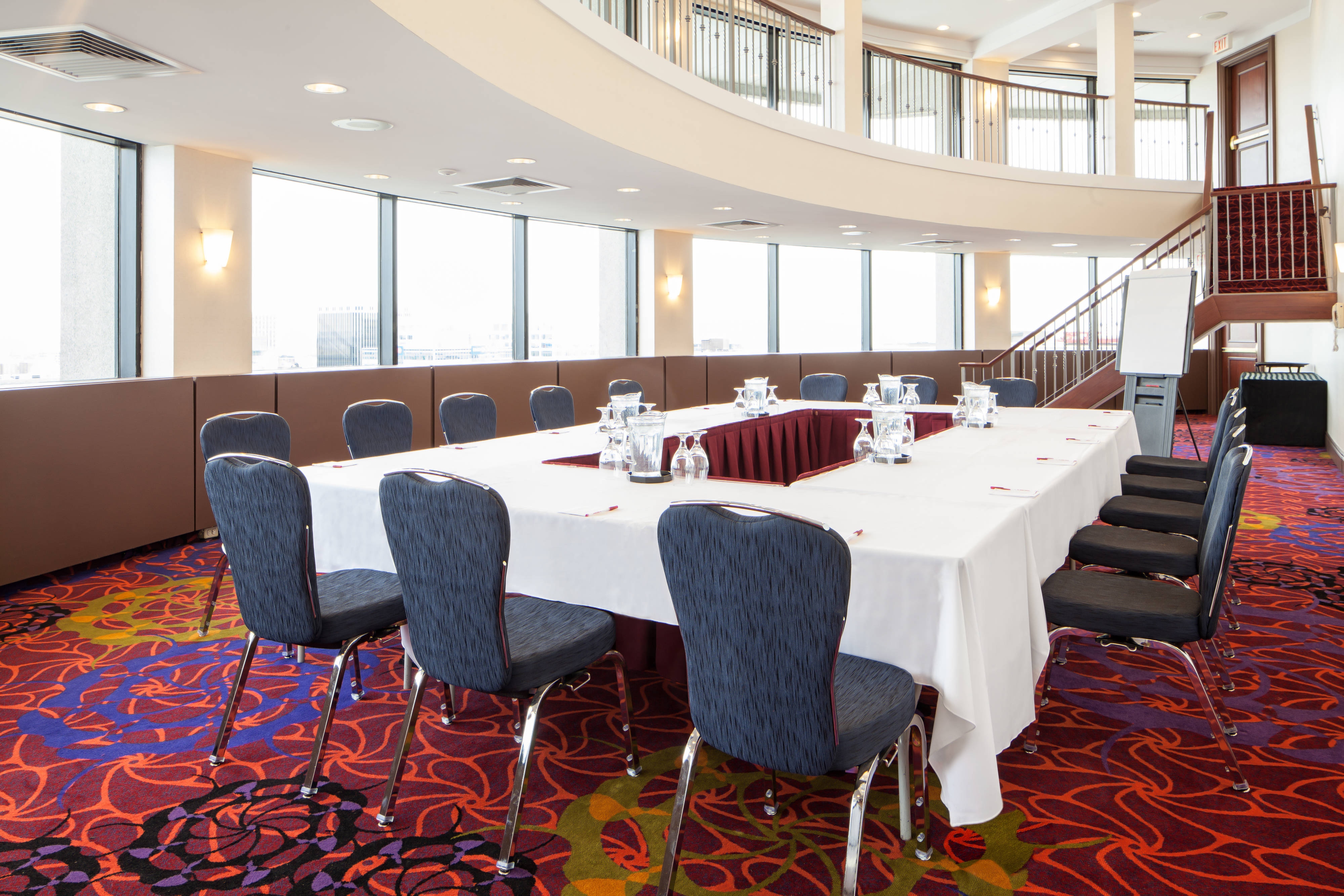 Curved room with floor-to-ceiling windows