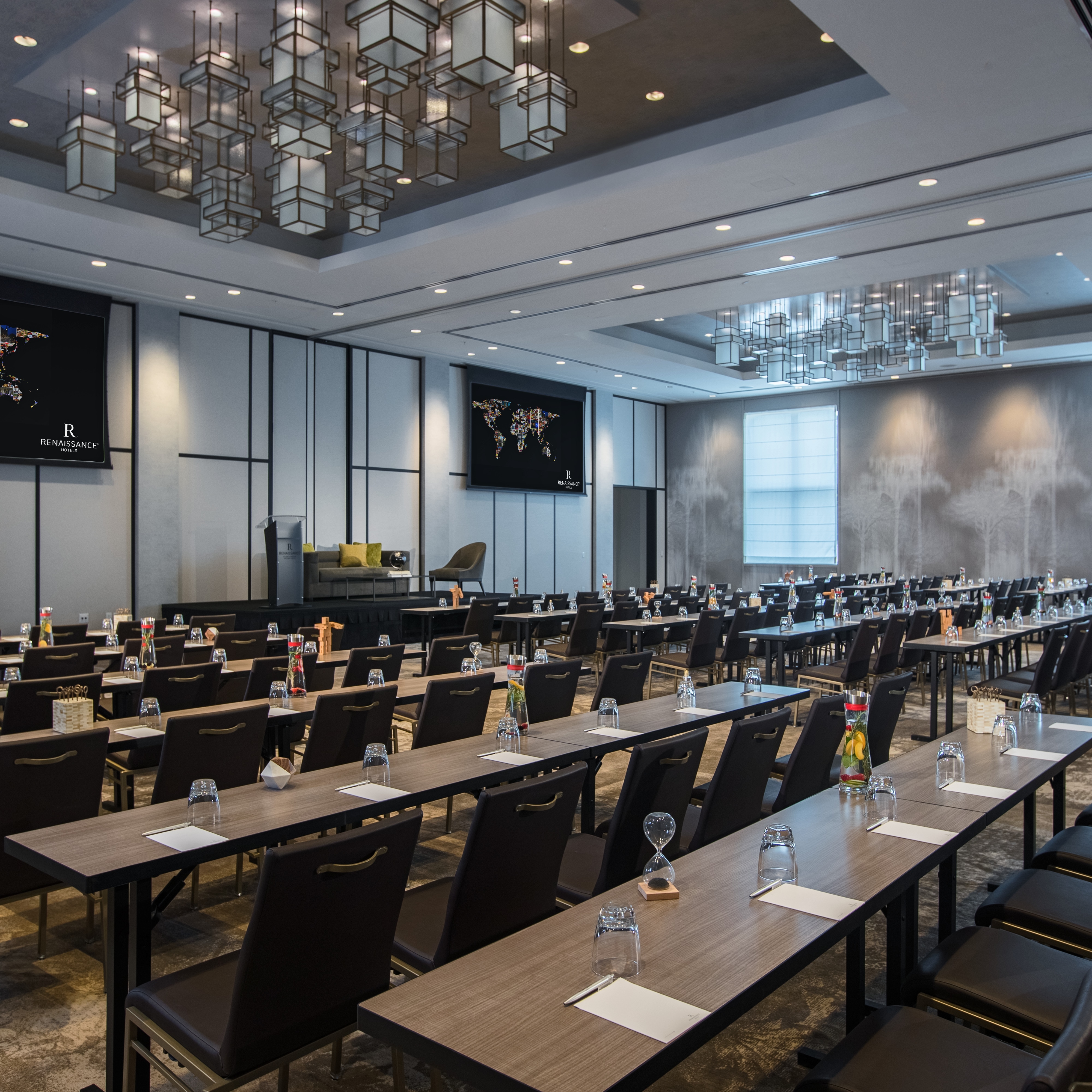 Ballroom event setup with rows of tables