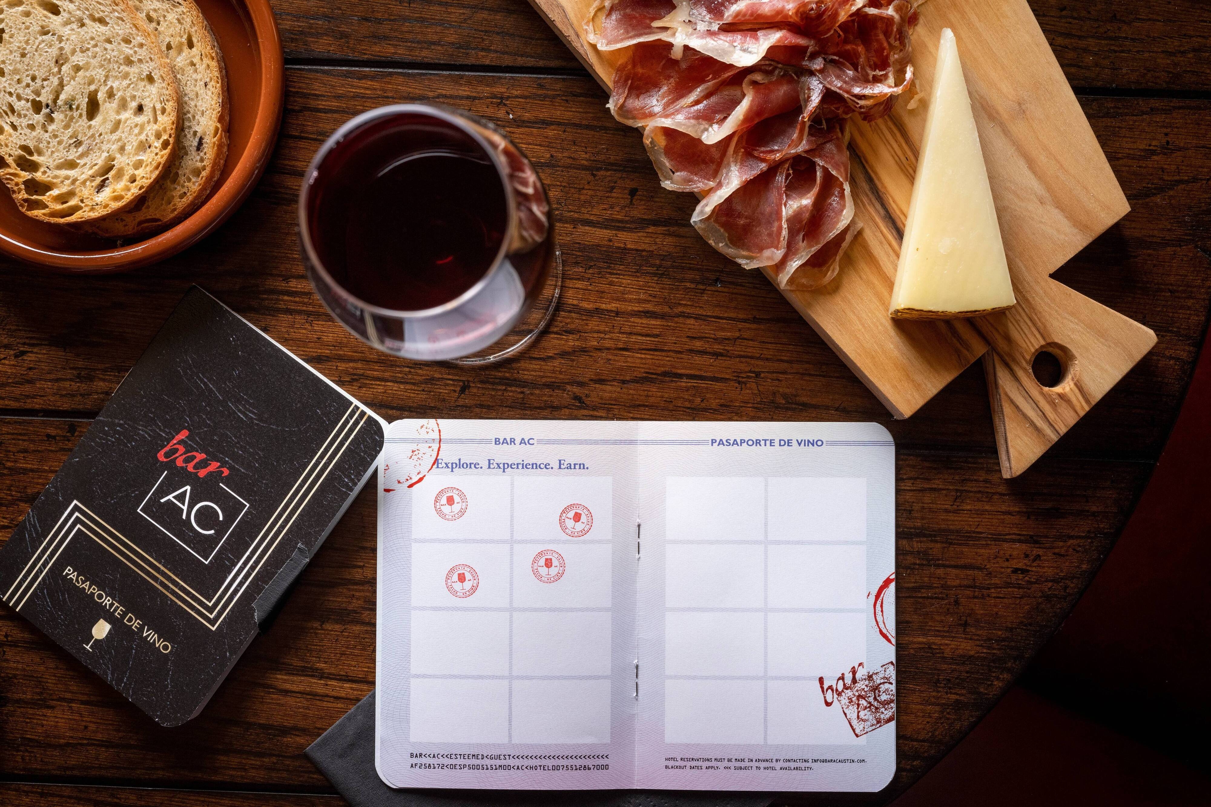Table with appetizers, wine, and wine passport