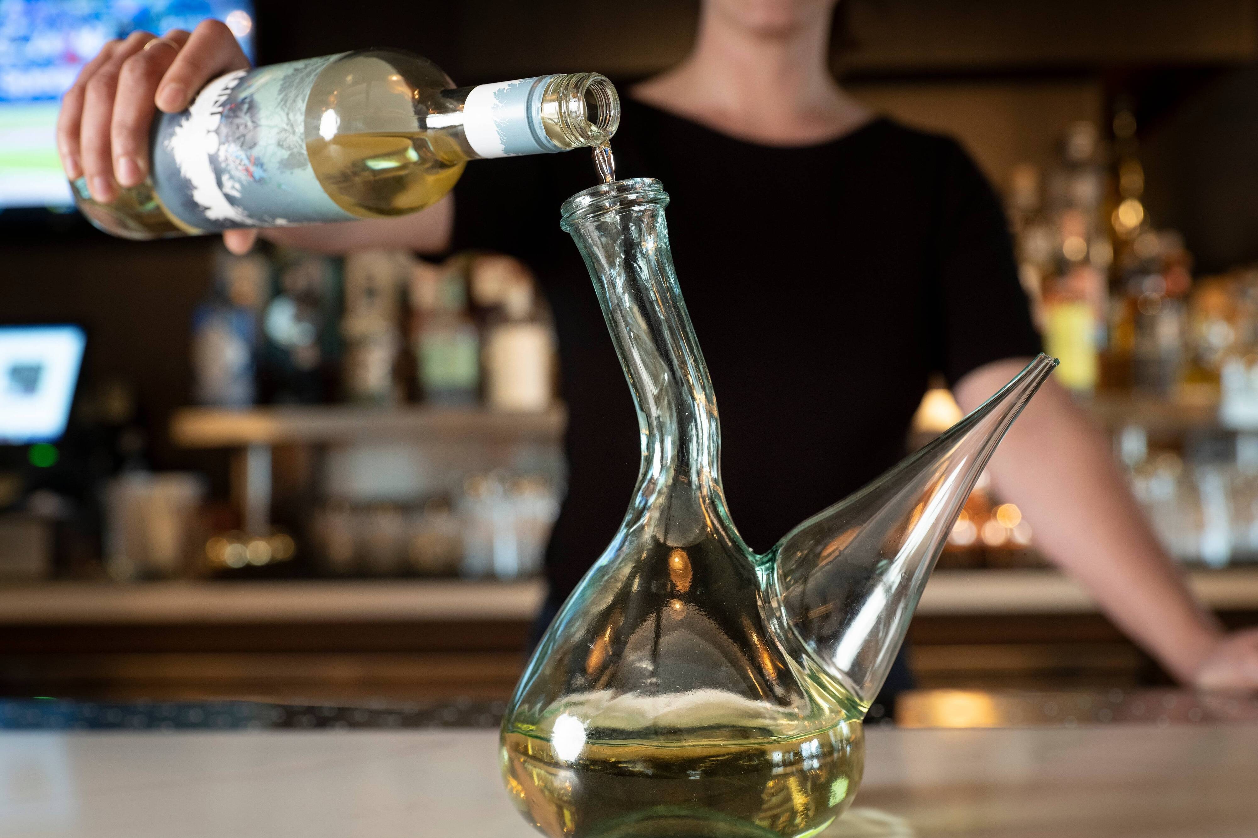 Bartender pouring alcohol
