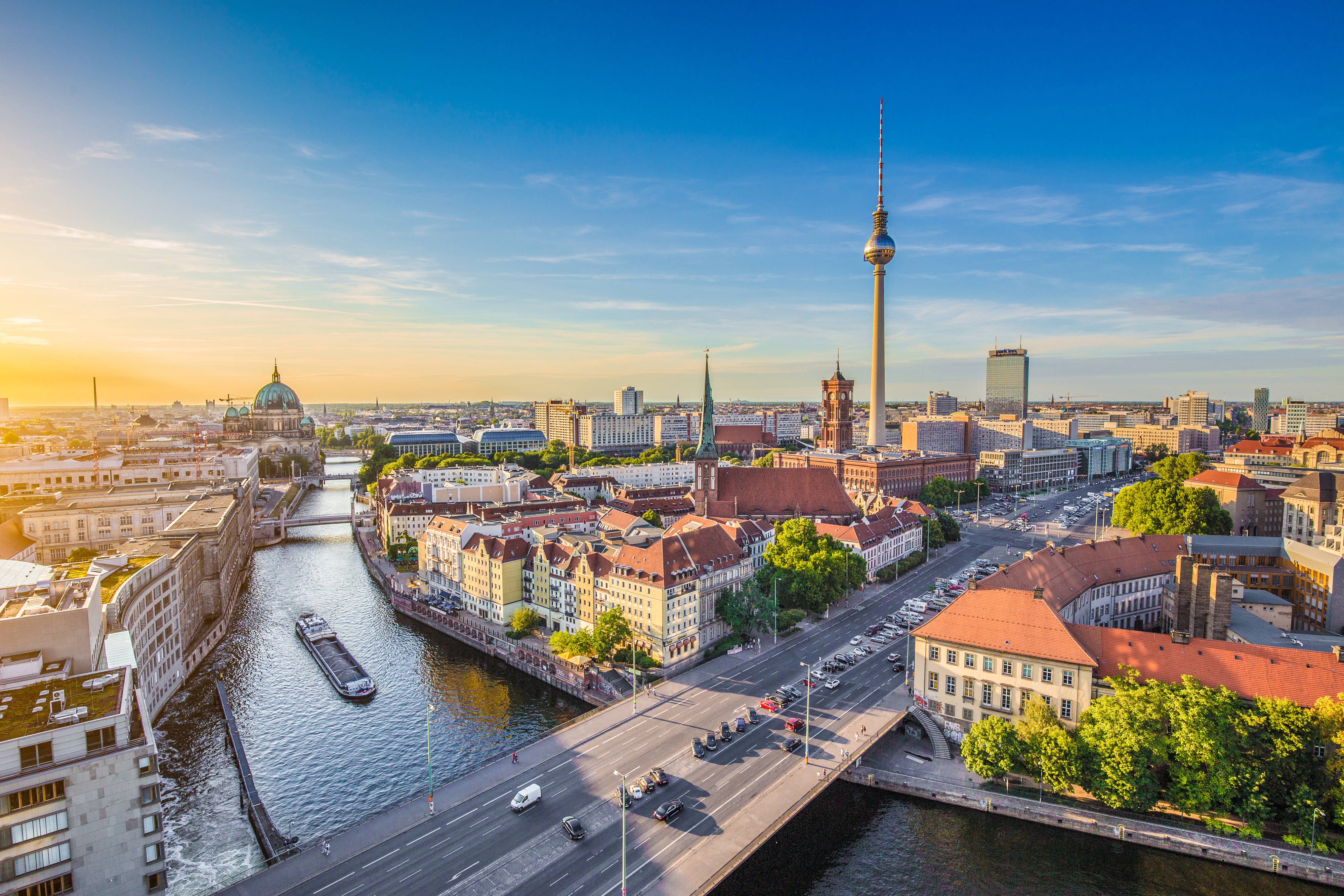 Aerial view of Berlin skyline with famous TV tower and Spree river in beautiful evening light at sunset, Germany; Shutterstock ID 309376361