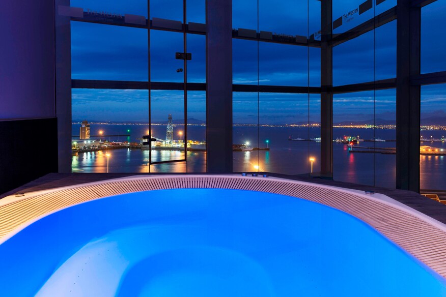View from jacuzzi with windows showing view of city.