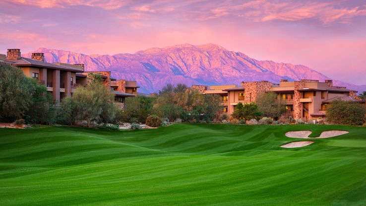 Desert Willow golf courses with view of mountain and resort buildings.