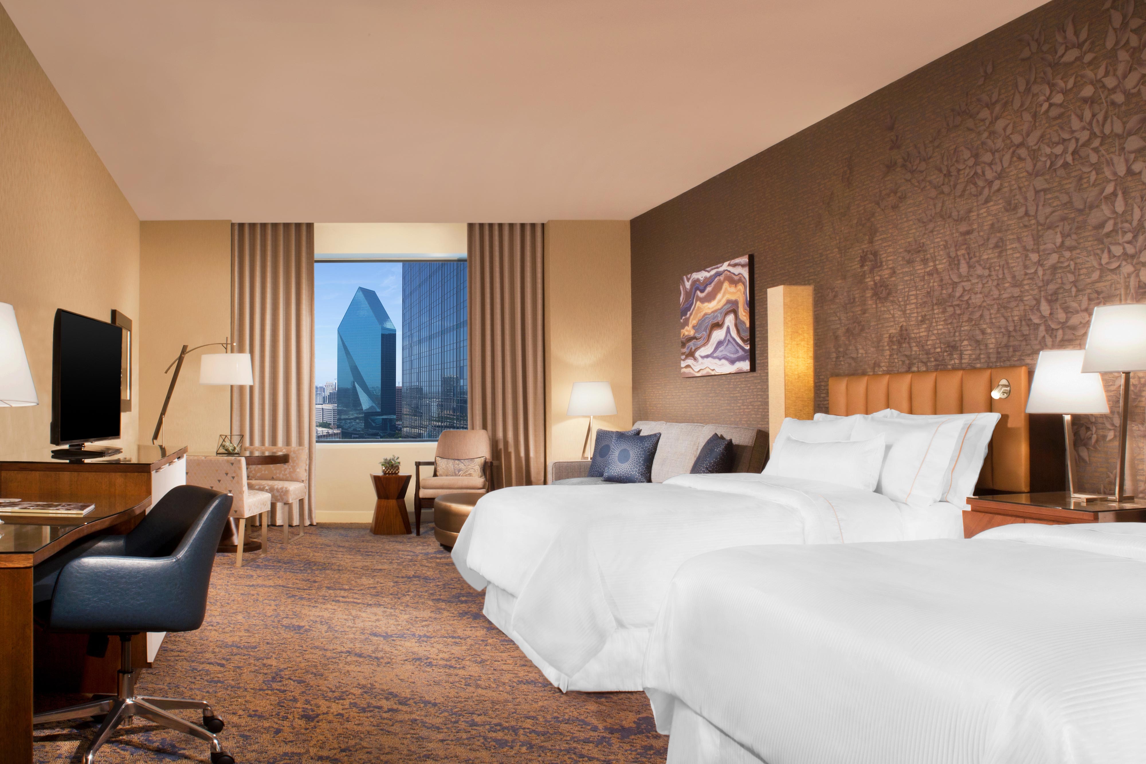 Guest room with two beds and exterior view